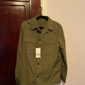 This is button down light jacket by Zara